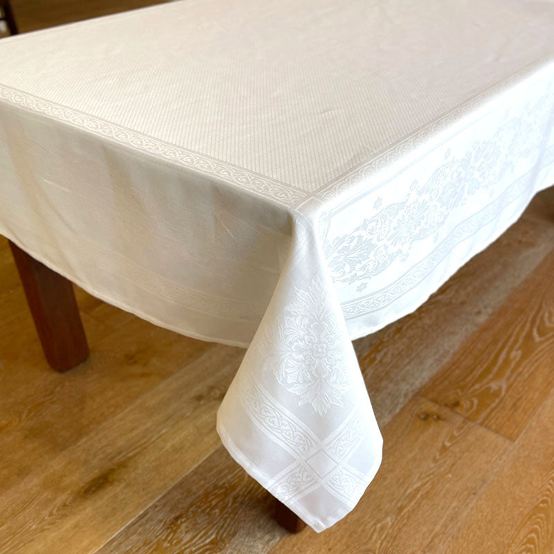 White textured tablecloth on a wooden table