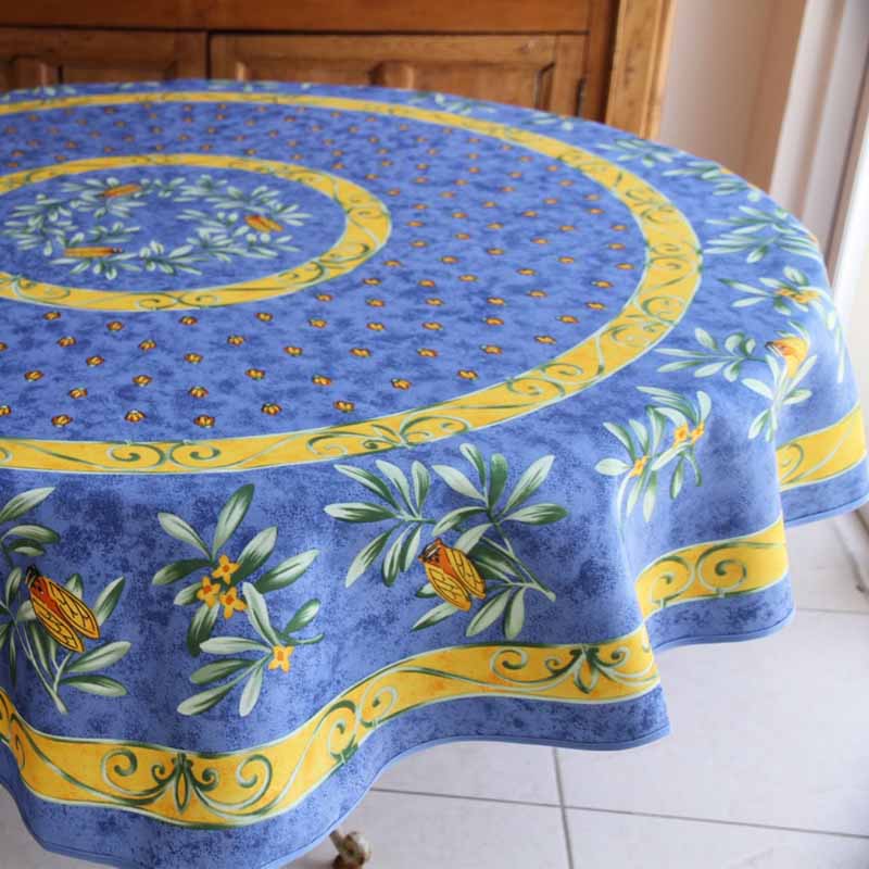 Round tablecloth with floral design on a wooden table