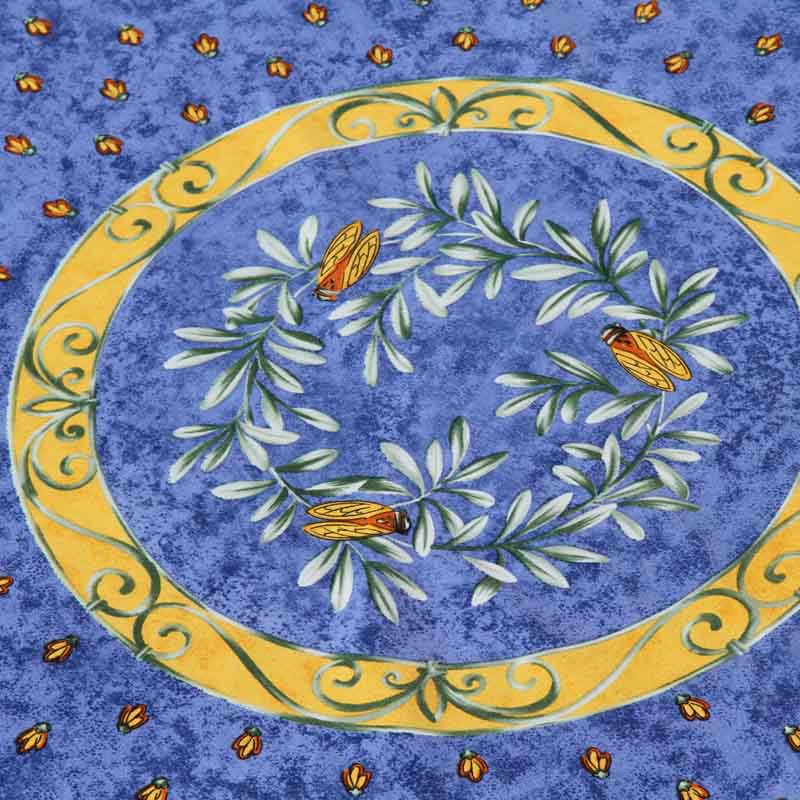 Decorative plate with leaf design and yellow border on a blue background