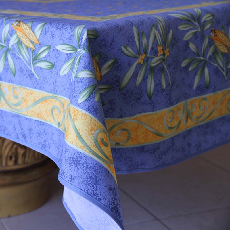 Decorative blue tablecloth with floral patterns on a white surface