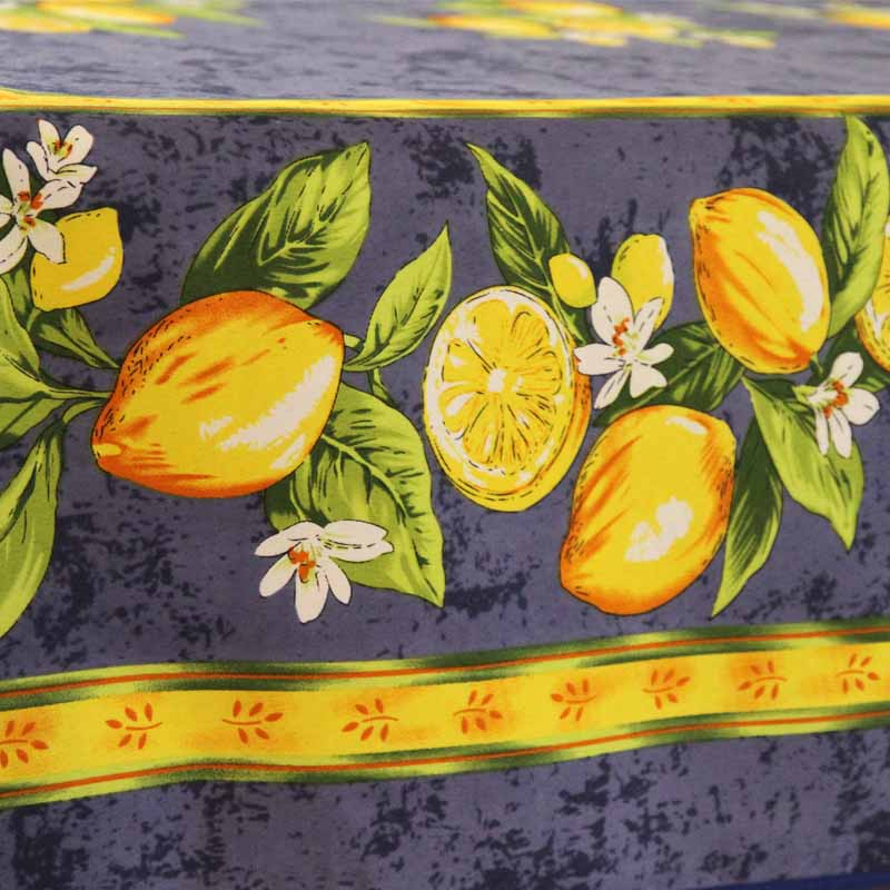 Tablelcoth with lemon and leaf pattern on a dark background