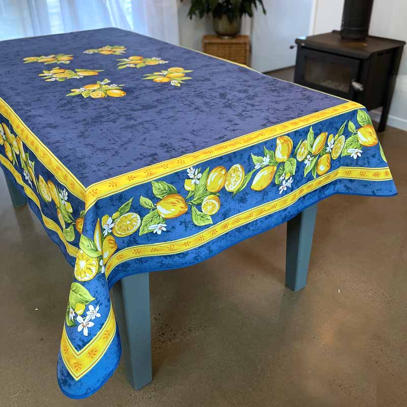 Blue tablecloth with lemon design on a table
