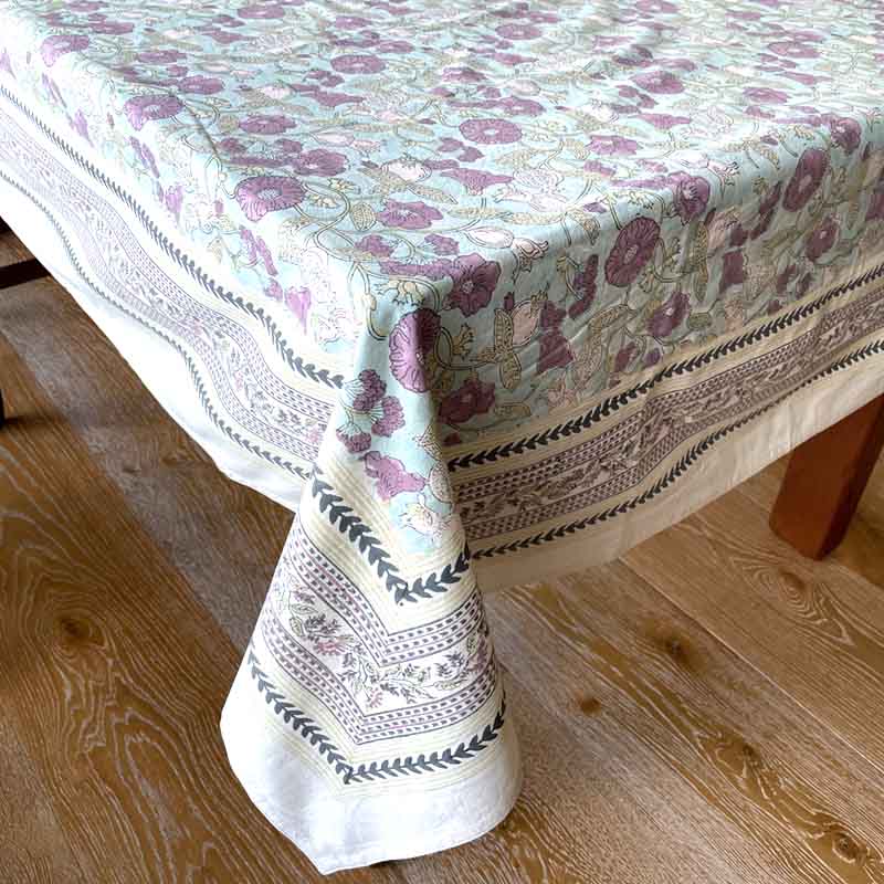Floral patterned tablecloth on a wooden table