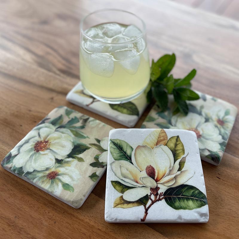 Magnolia design resin drink coasters. Set of 4 with cork backing.