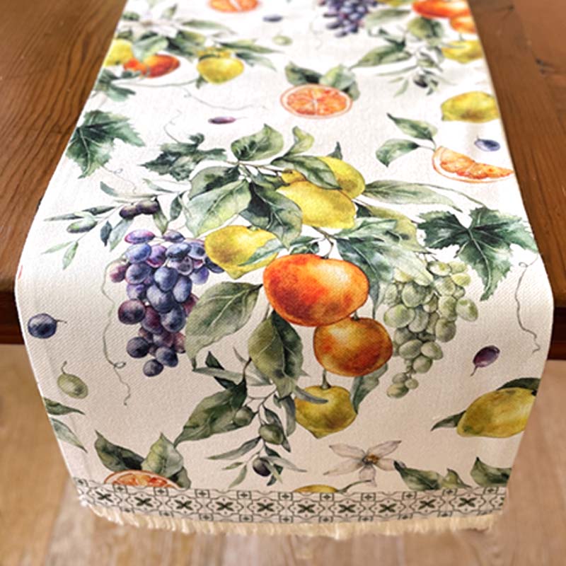 Table runner with fruit pattern on a wooden table