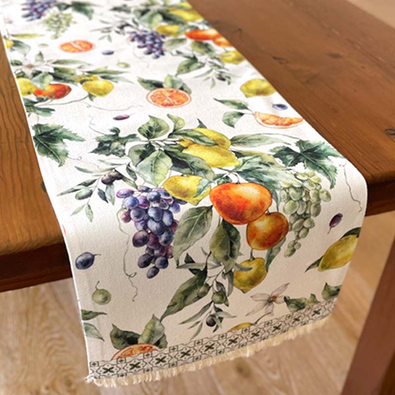Table runner with fruit design on a wooden table