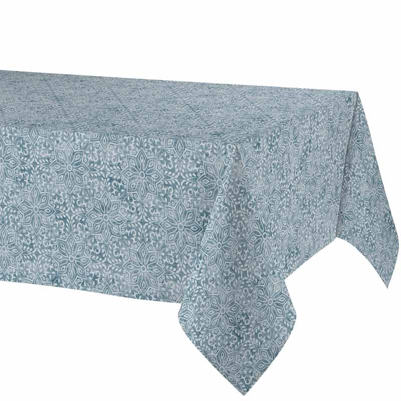 A rectangular tablecloth with a repeating blue and white floral or geometric medallion pattern, shown draped over a table against a plain white background.