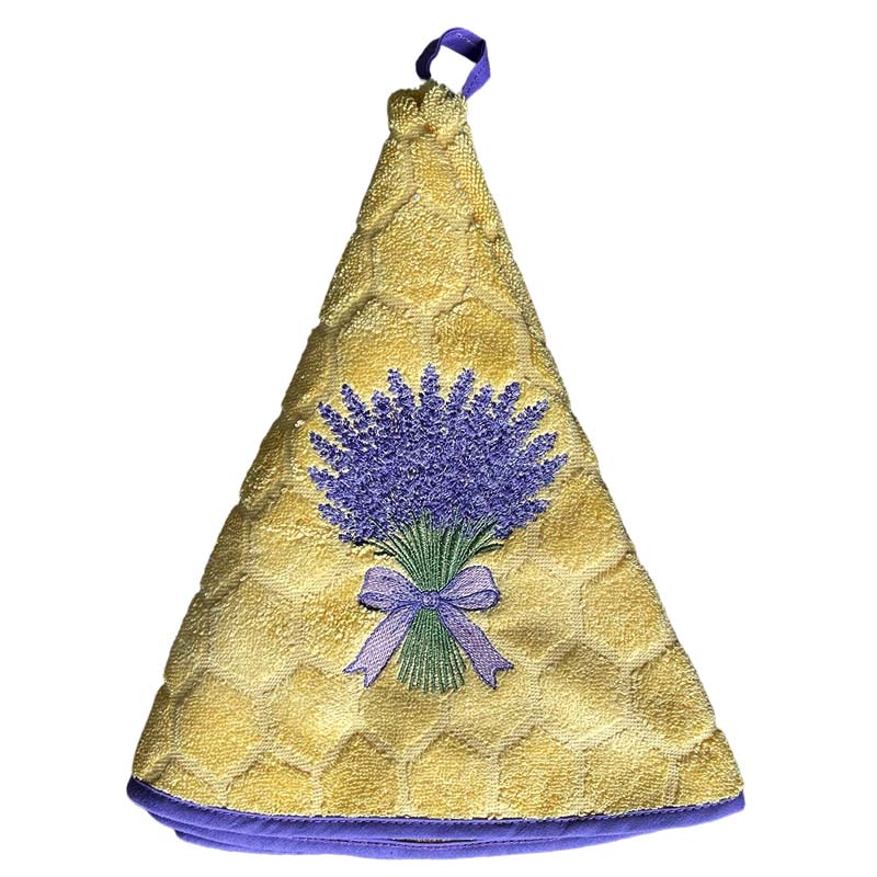 Round hand towel in yellow with lavender embroidery and purple trim hanging on a loop.