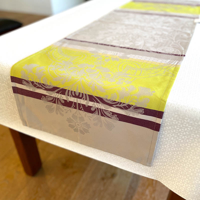 Table runner with yellow and purple design on a table
