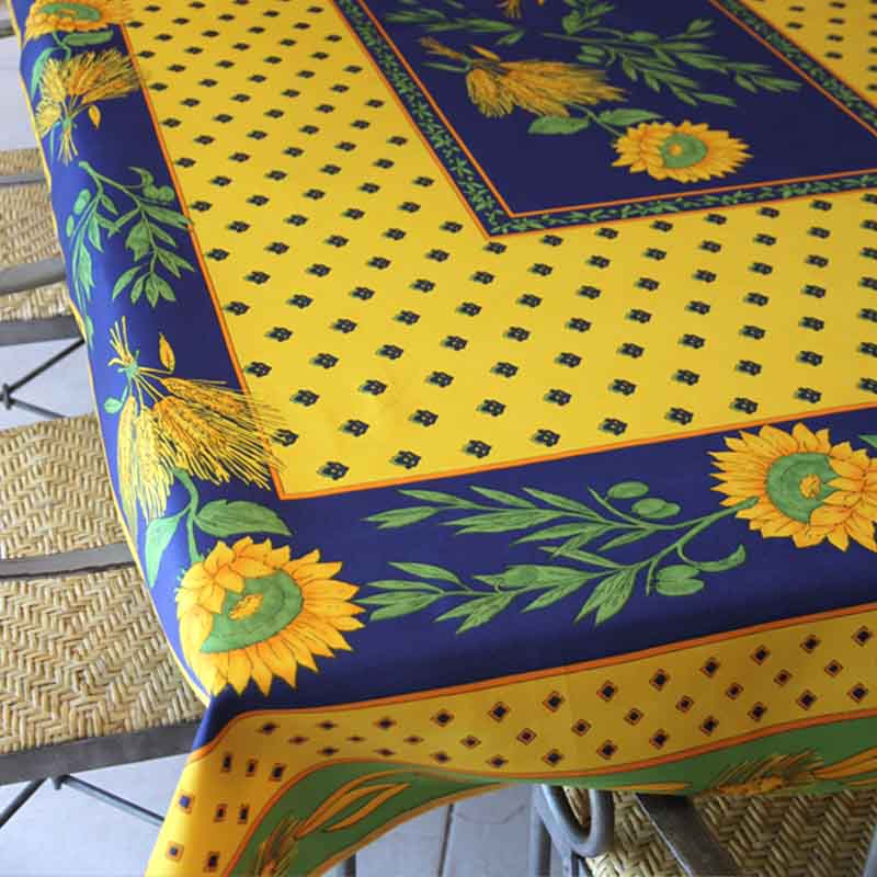 Colorful tablecloth with sunflower design on a table