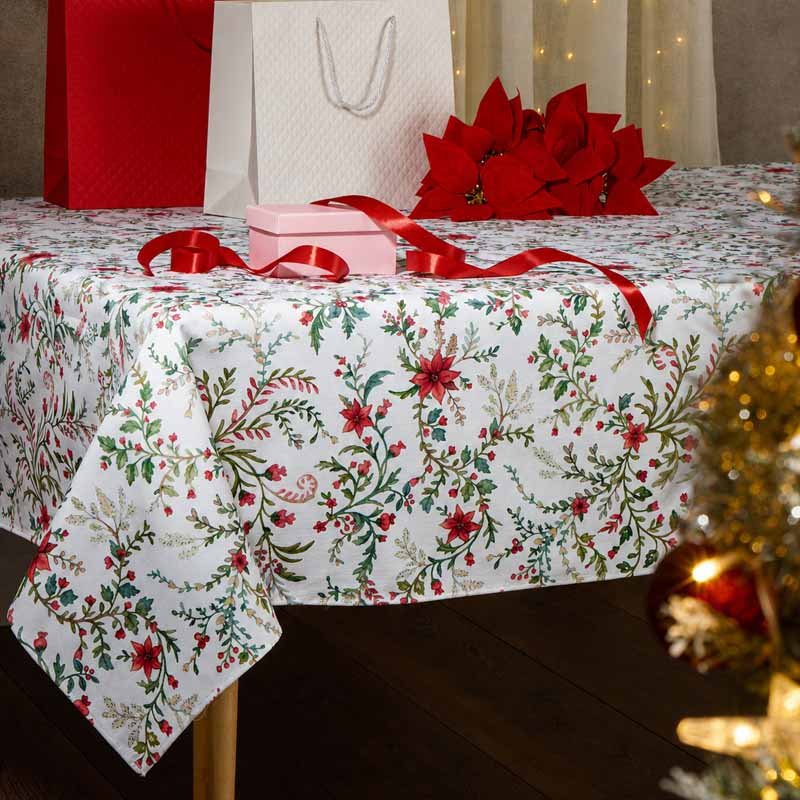 Laponia rectangle tablecloth with red flowers and green foliage, styled with Christmas gifts