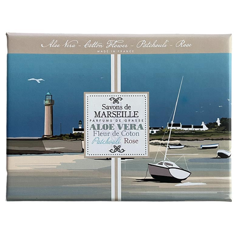 A rectangular boxed fragrance product shown against a plain white background. The box features a coastal illustration with a lighthouse, boats, shoreline, and a central label reading 'Savons de Marseille' and 'Aloe Vera - Coton Fleurs - Patchouli - Rose'.