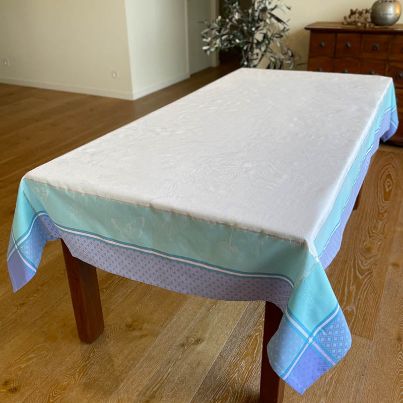 Biarritz Aqua Purple jacquard tablecloth on a dining table