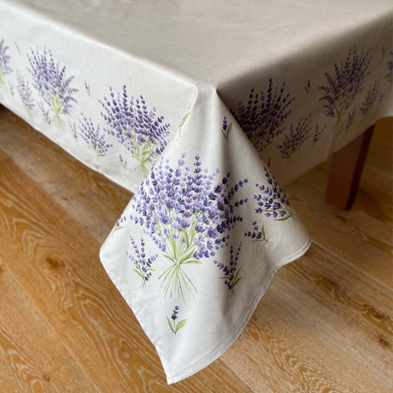 Corner of French stain resistant tablecloth with lavender bunches