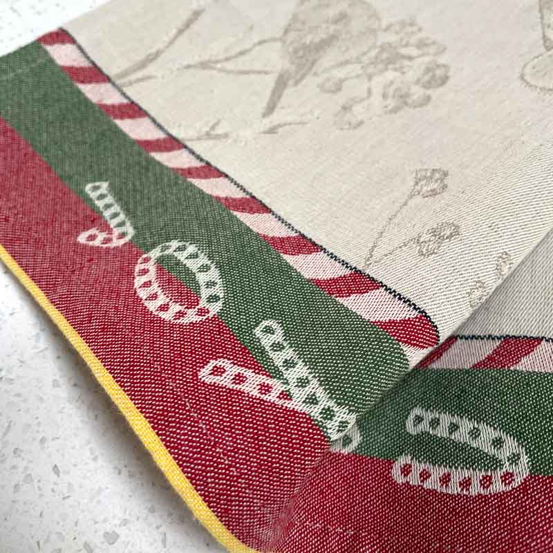 The border of a Christmas tea towel showing the jacquard weave.