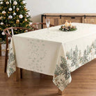 Christmas tablecloth with fir trees and deer design on the side borders.