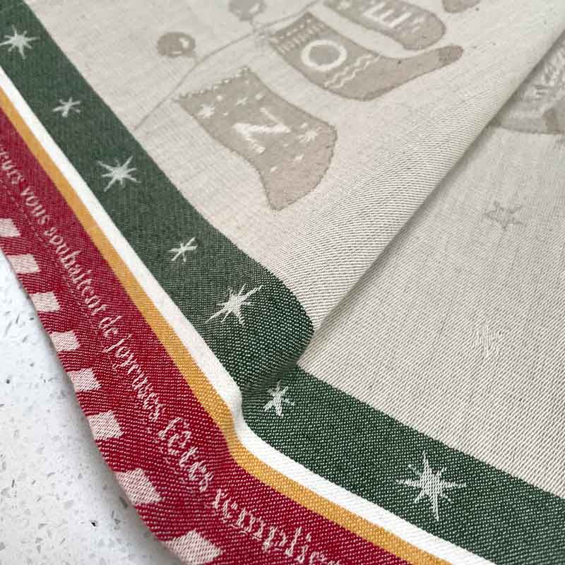Close up of Christmas Tree tea towel border showing jacquard weave