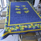 Blue tablecloth with lemon pattern on a table