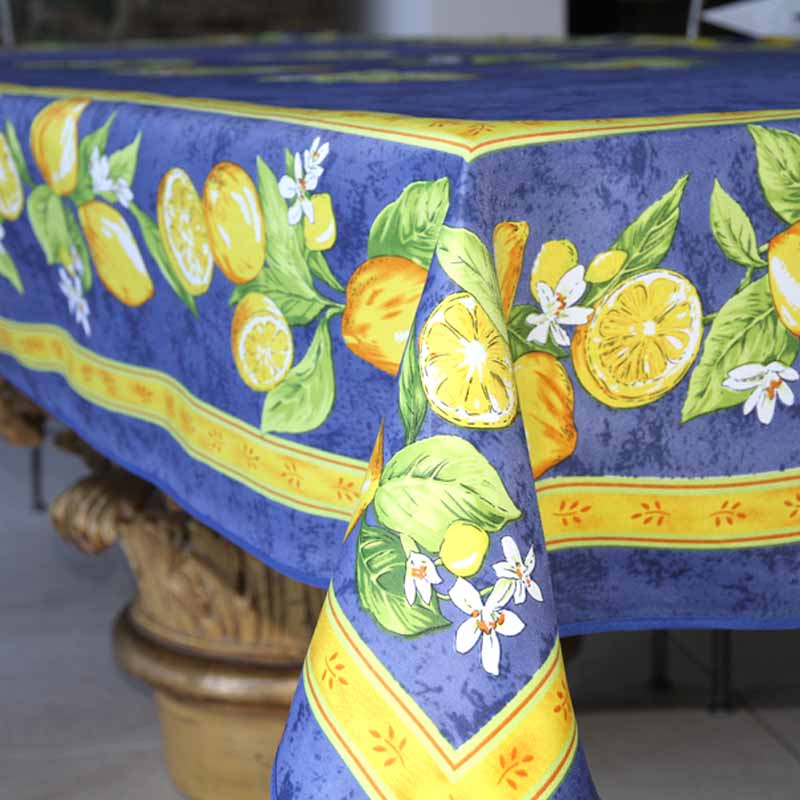 Tablecloth with lemon and orange design on a blue background