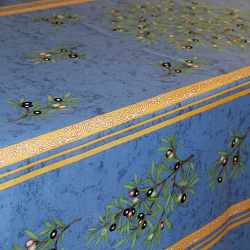 Decorative tablecloth with olive branch pattern on a blue background