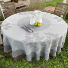 Round table with a patterned tablecloth outdoors