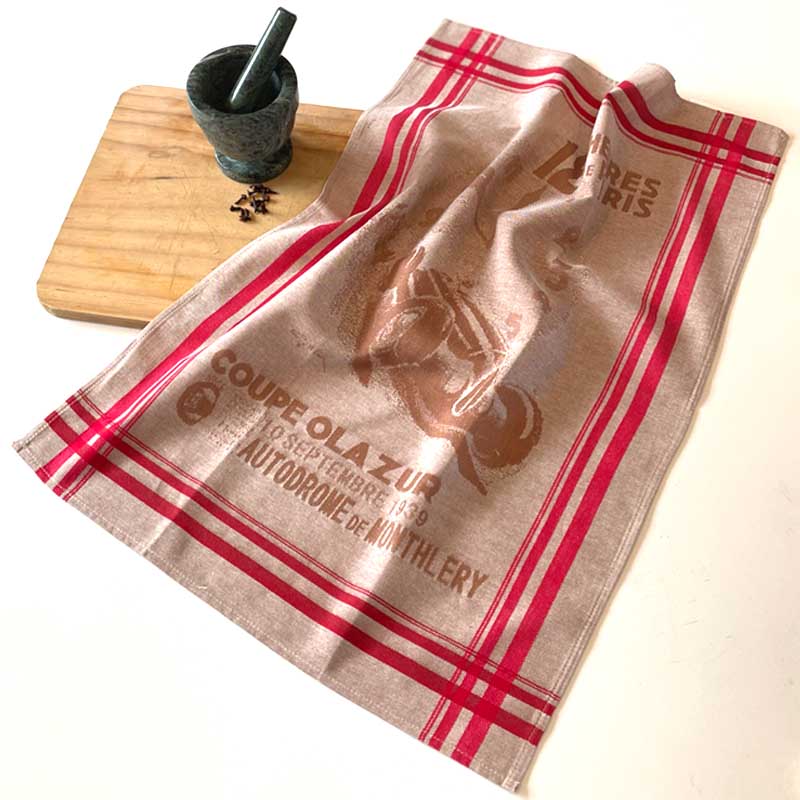 Beige towel with red stripes and branding on a white background