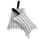Two small square fabric hanging pouches with black pinstripes on a white background, one larger and one smaller, both with black hanging straps. Filled with lavender.