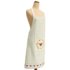 Checkered apron with bee design on a mannequin against a white background