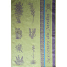 Green fabric with purple floral patterns and 'Senteurs du Jardin' text on a white background