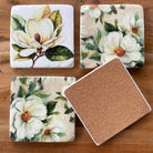 Magnolia design resin drink coasters. Set of 4 with cork backing.