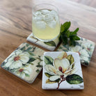 Magnolia design resin drink coasters. Set of 4 with cork backing.