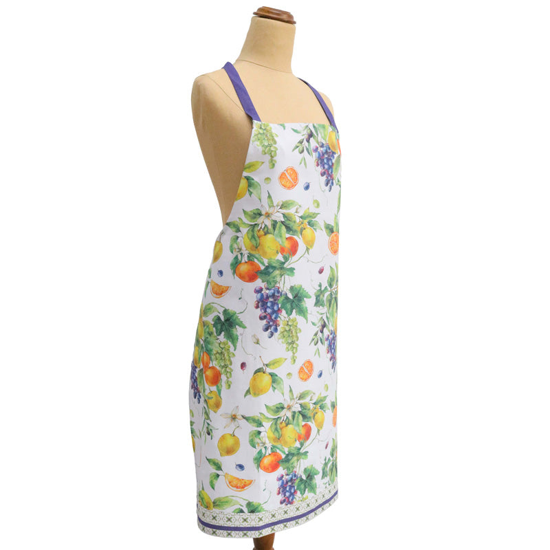 Dress with fruit pattern on a mannequin against a white background