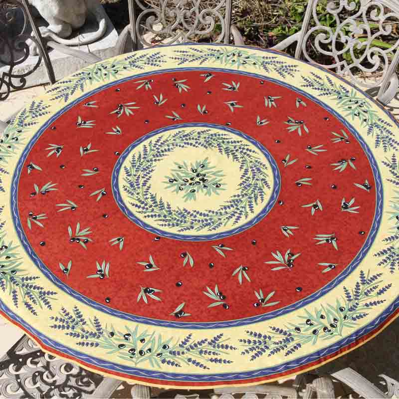 Decorative round tablecloth with a red background featuring olives and lavender