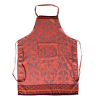 Orange apron with floral pattern on a white background