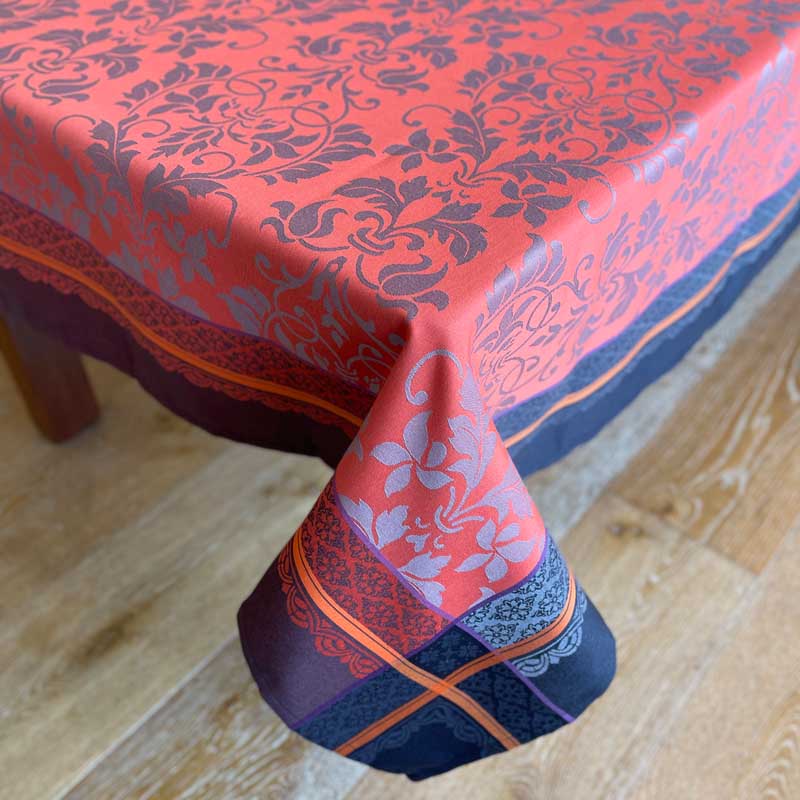 Decorative tablecloth with floral pattern on a wooden table