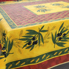 Decorative tablecloth with olive branch and wheat design on a yellow background