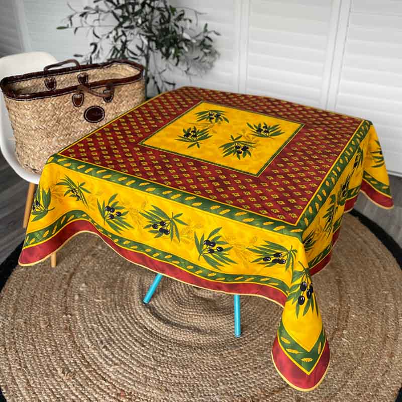 Square tablecloth in red and yellow in a living room setting