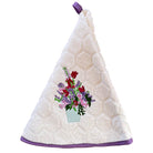 An off-white textured kitchen towel with a purple hanging loop and purple trim, featuring an embroidered bouquet of red, pink, and purple flowers in a light blue pot.