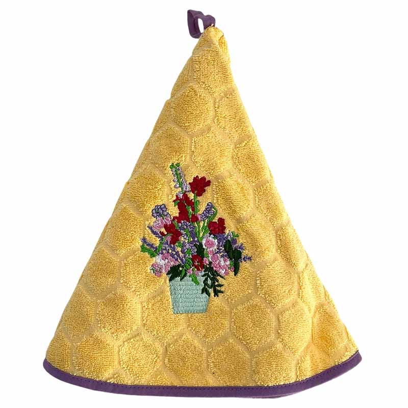 Yellow embroidered hanging towel with a floral design on a white background