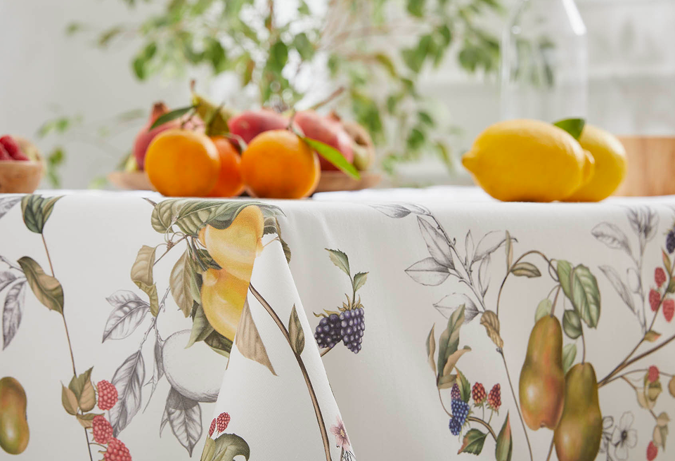 Fruit patterned tablecloth on dining table – French Affair About Page