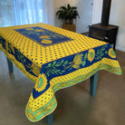 Tablecloth with sunflower design on a table in a room.