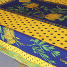 Decorative tablecloth with floral and geometric patterns on a blue and yellow background