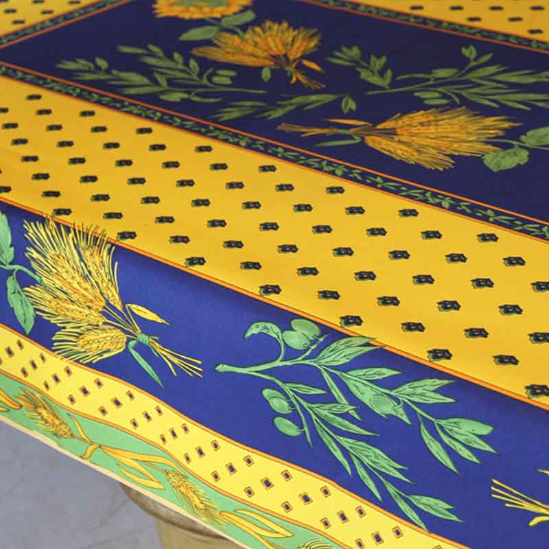 Decorative tablecloth with floral and geometric patterns on a blue and yellow background