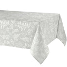 A light gray tablecloth with a subtle white botanical leaf pattern, draped over a table against a plain white background.