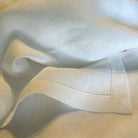 White linen tablecloth corners