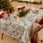 Laponia rectangle tablecloth set for Christmas with greenery, candles and white plates