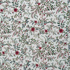 Close view of the red floral and green foliage pattern on the Laponia tablecloth