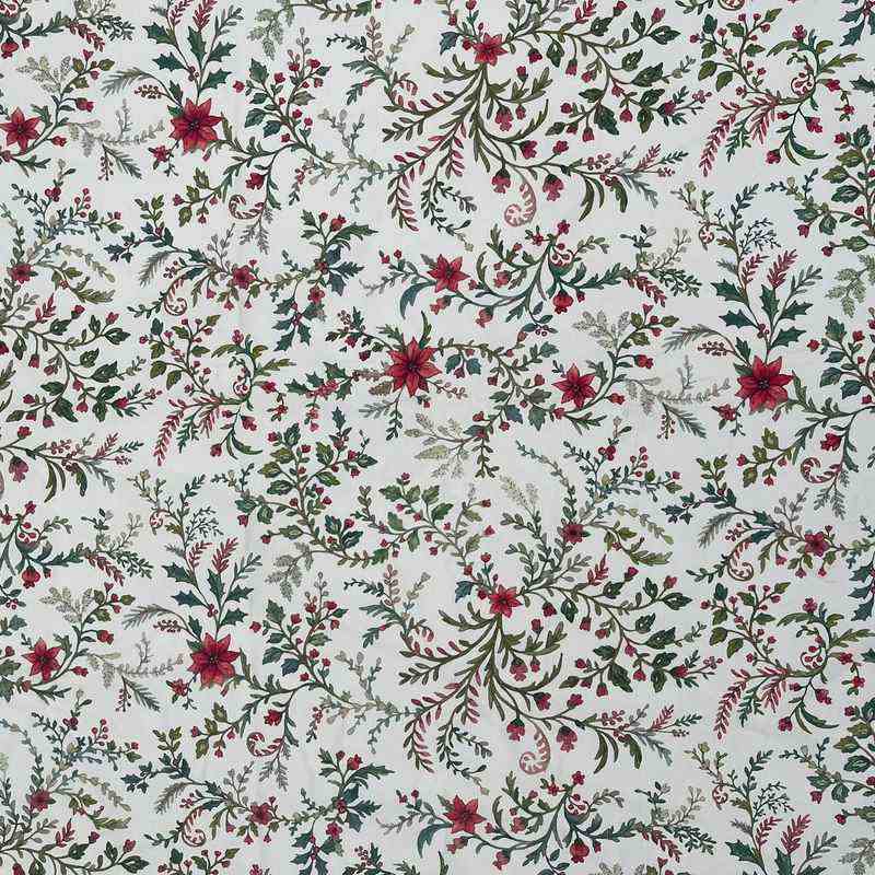 Close view of the red floral and green foliage pattern on the Laponia tablecloth