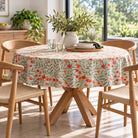 Wild Poppy floral tablecloth on a round wooden dining table